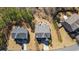 Aerial view of two residential homes showcasing their layouts and surrounding landscaping at 139 Stargaze Rdg, Canton, GA 30114