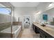 A luxurious bathroom with a soaking tub and a dual sink vanity with granite countertops at 139 Stargaze Rdg, Canton, GA 30114