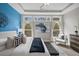 Bright bedroom features a tray ceiling, blue accent wall, and natural light at 139 Stargaze Rdg, Canton, GA 30114