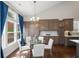 Bright eat-in kitchen featuring hardwood floors, ample storage, and a granite island with bar seating at 139 Stargaze Rdg, Canton, GA 30114