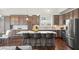 Modern kitchen with granite countertops, stainless steel appliances, and a spacious island with bar seating at 139 Stargaze Rdg, Canton, GA 30114