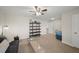 A bright living room with a ceiling fan and a seating area with a vintage green desk at 139 Stargaze Rdg, Canton, GA 30114