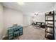A comfortable living room with a ceiling fan and a desk with vintage green drawers at 139 Stargaze Rdg, Canton, GA 30114