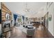 Spacious living room with wood floors, fireplace, high ceilings, and an open floor plan to the kitchen at 139 Stargaze Rdg, Canton, GA 30114