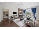 Comfortable living room with a fireplace and large windows offering scenic views of the surrounding landscape at 139 Stargaze Rdg, Canton, GA 30114