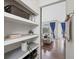 Open shelving near a living area with hardwood floors and large windows at 139 Stargaze Rdg, Canton, GA 30114