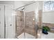 Glass shower with tiled walls and seat, set near a modern bathroom at 139 Stargaze Rdg, Canton, GA 30114