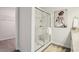 Bathroom featuring glass shower doors, modern art and luxury finishes at 6347 Towhee Way, Morrow, GA 30260