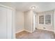 Cozy bedroom with natural light, wood floors, and a closet at 165 Holly Nw Rd, Atlanta, GA 30314