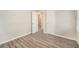 Cozy bedroom featuring wood floors and multiple closets at 165 Holly Nw Rd, Atlanta, GA 30314