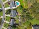 An aerial view displays backyard and wooded landscapes at 1665 Millhouse Lndg, Marietta, GA 30066
