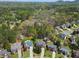 An aerial view captures the community, highlighting lush landscapes and well-spaced homes at 1665 Millhouse Lndg, Marietta, GA 30066