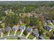 An aerial view of the neighborhood showcases tree coverage, homes, and well-maintained lawns at 1665 Millhouse Lndg, Marietta, GA 30066