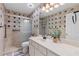 Well-lit bathroom featuring a tiled shower and walls, white cabinets, and modern fixtures at 1665 Millhouse Lndg, Marietta, GA 30066