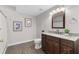 Bathroom features granite counters, wood cabinets, and tile flooring at 1665 Millhouse Lndg, Marietta, GA 30066