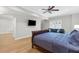 Comfortable bedroom with a bed, sofa, and TV offering a peaceful retreat for rest and relaxation at 1665 Millhouse Lndg, Marietta, GA 30066