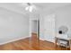 Clean bedroom featuring hardwood floors, white trim, and a ceiling fan at 1665 Millhouse Lndg, Marietta, GA 30066