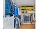 Spacious walk-in closet with custom shelving and hanging rods, providing ample storage and organization solutions at 1665 Millhouse Lndg, Marietta, GA 30066
