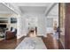 Inviting foyer with hardwood floors, high ceilings, and a view into the living spaces at 1665 Millhouse Lndg, Marietta, GA 30066