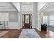 Inviting foyer with hardwood floors, high ceilings, and a view into the living spaces at 1665 Millhouse Lndg, Marietta, GA 30066