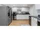 Spacious kitchen featuring stainless appliances and white cabinets at 1665 Millhouse Lndg, Marietta, GA 30066