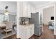 View of modern eat-in kitchen area with stainless appliances, granite counters, and access to dining and living areas at 1665 Millhouse Lndg, Marietta, GA 30066