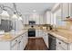 Bright kitchen features granite countertops, stainless steel appliances, and ample cabinet space at 1665 Millhouse Lndg, Marietta, GA 30066
