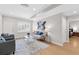 Living room with seating, decor, hardwood flooring, and windows at 1665 Millhouse Lndg, Marietta, GA 30066