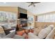 Bright living room with stone fireplace, large windows, and a comfortable seating arrangement at 1665 Millhouse Lndg, Marietta, GA 30066