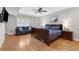 Spacious main bedroom with hardwood floors, large windows and ceiling fan at 1665 Millhouse Lndg, Marietta, GA 30066