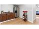 Entertainment area featuring a wet bar with a sink, cabinets, stainless steel refrigerator, and a popcorn machine at 1665 Millhouse Lndg, Marietta, GA 30066