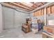 Unfinished basement with concrete walls and floor offers ample storage space at 1956 Grace Arbor Ne Ct, Atlanta, GA 30329