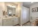 Bright bathroom featuring a vanity with double sinks and a shower-tub combination at 1956 Grace Arbor Ne Ct, Atlanta, GA 30329