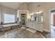 Bathroom with double sinks, large tub, separate shower, granite countertops, and tile floor at 1956 Grace Arbor Ne Ct, Atlanta, GA 30329