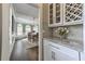 Butler's pantry with wine storage, cabinets, and countertop space at 1956 Grace Arbor Ne Ct, Atlanta, GA 30329