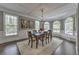Dining room with coffered ceilings, chandelier lighting, and multiple windows at 1956 Grace Arbor Ne Ct, Atlanta, GA 30329