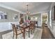Elegant dining room featuring coffered ceilings and hardwood floors at 1956 Grace Arbor Ne Ct, Atlanta, GA 30329