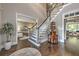 Grand foyer featuring hardwood floors, staircase, and decorative table at 1956 Grace Arbor Ne Ct, Atlanta, GA 30329