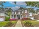 Beautiful two-story brick home with a welcoming front porch and meticulously landscaped yard at 1956 Grace Arbor Ne Ct, Atlanta, GA 30329