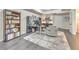 Well-organized home office with a cozy rug, built-in shelving, desk, and modern computer setup at 1956 Grace Arbor Ne Ct, Atlanta, GA 30329