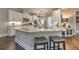 Bright kitchen with an island, granite countertops and white cabinets at 1956 Grace Arbor Ne Ct, Atlanta, GA 30329
