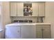 Laundry room with sink, folding counter, washer, and dryer with tons of storage at 1956 Grace Arbor Ne Ct, Atlanta, GA 30329