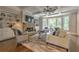 Bright living room with a stone fireplace, built-in bookshelves, and backyard views at 1956 Grace Arbor Ne Ct, Atlanta, GA 30329