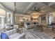 Spacious living room featuring coffered ceilings, large windows, and an open layout at 1956 Grace Arbor Ne Ct, Atlanta, GA 30329