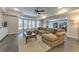 Spacious living room featuring modern furnishings and fixtures, open to the cozy work from home office at 1956 Grace Arbor Ne Ct, Atlanta, GA 30329