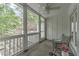 Relaxing screened porch with comfortable seating and views of the lush greenery in the backyard at 1956 Grace Arbor Ne Ct, Atlanta, GA 30329