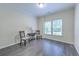 Sunny bonus room with hardwood floors, large windows, and stylish accent furnishings at 1956 Grace Arbor Ne Ct, Atlanta, GA 30329