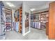 Large walk-in closet with custom shelving, mirror and plenty of space for clothes and storage at 1956 Grace Arbor Ne Ct, Atlanta, GA 30329