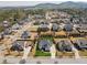 Expansive aerial shot showing a well-planned community, mature trees, and mountain views in the distance at 214 Leland Way, Woodstock, GA 30188