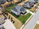 Beautiful aerial view of a home featuring manicured lawns, mature trees, and a private backyard with a play set at 214 Leland Way, Woodstock, GA 30188